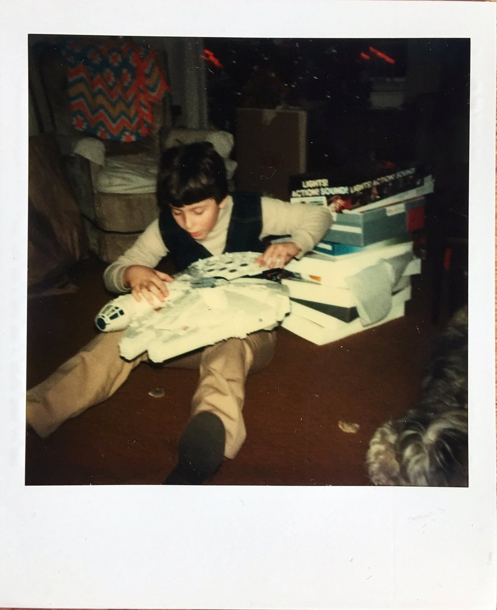 Another favorite of mine, a grandson opening his Christmas present. We've been in touch and I hope to reunite these Polaroids with him and other family members.